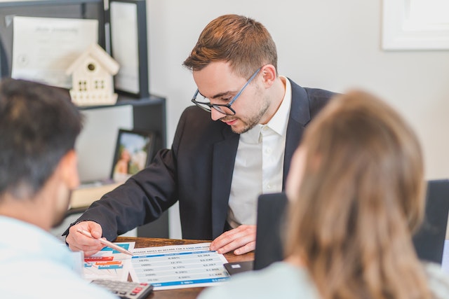 Person reviewing a document behind a desk